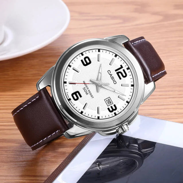 Casio MTP-1314L-7A — watch arranged on a wooden surface.