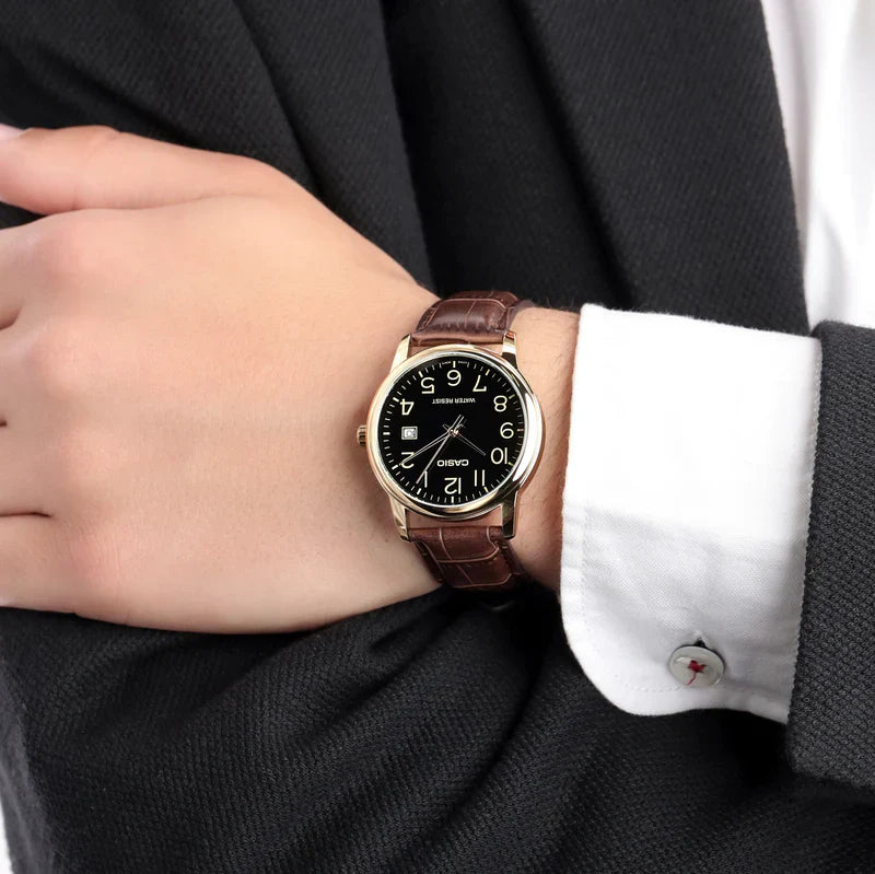 Casio MTP-V002GL-1B — watch worn with a suit.