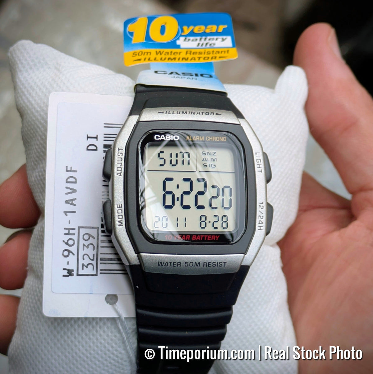 Casio W-96H-1A — watch on display cushion with model tag.