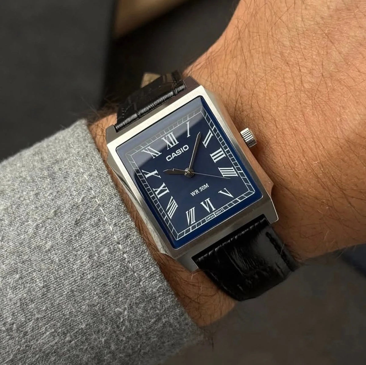 Casio MTP-B190L-2B — watch worn with a grey sleeve.